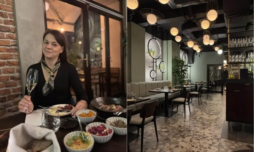 Kobieta z kieliszkiem wina w jednej z klimatycznych restauracji na krakowskim Starym Mieście. Wnętrze lokalu z nowoczesnym designem.